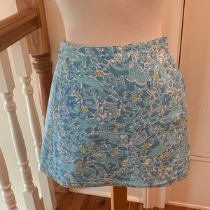 Lilly Pulitzer reversible monkey chef and sunflower lion wrap skirt.
